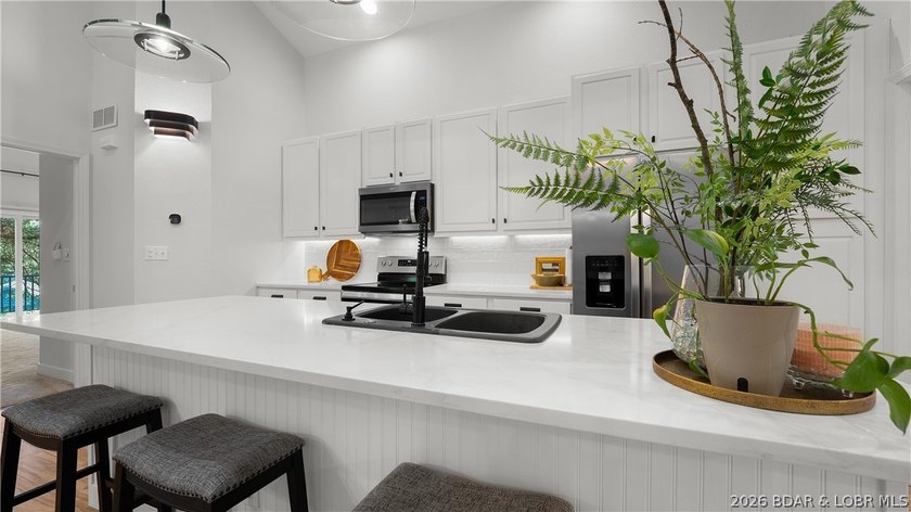 Completely remodeled, fully furnished, and truly turnkey, this - photo 3