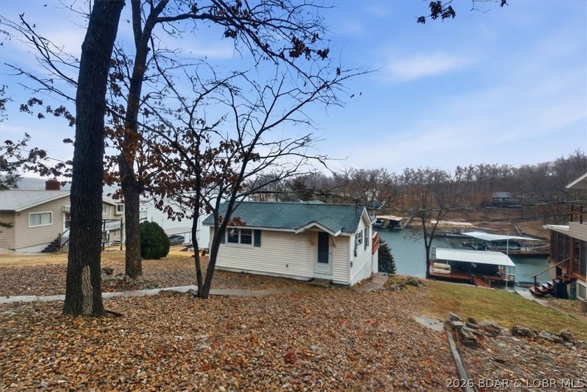 Discover this unique 2-bedroom, 1-bath lakefront cabin offering - photo 3