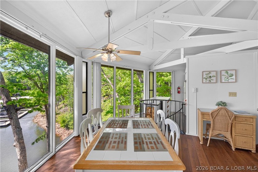 Enjoy treehouse-style living with true lakefront views and all - photo 3