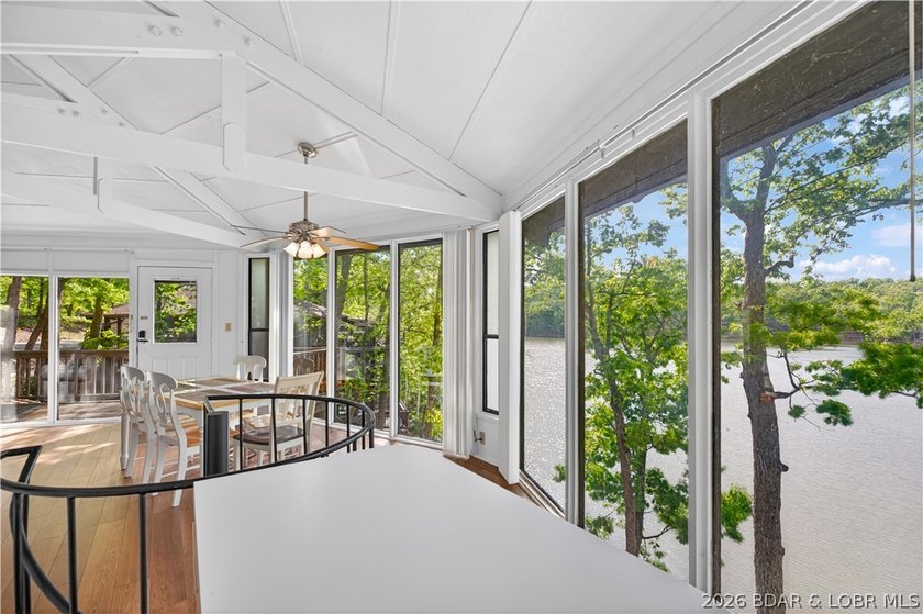 Enjoy treehouse-style living with true lakefront views and all - photo 9