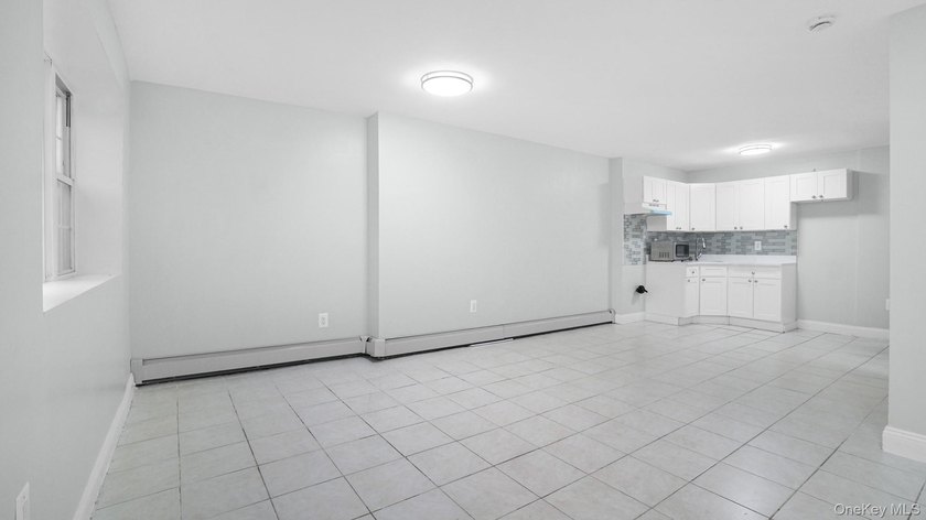 Fully renovated 2-family, 2007 brick-built house. Features 3 bed - photo 8