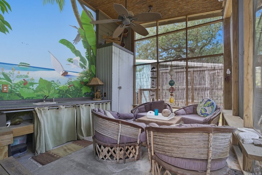 This one-of-a-kind coastal retreat blends island-style charm - photo 22