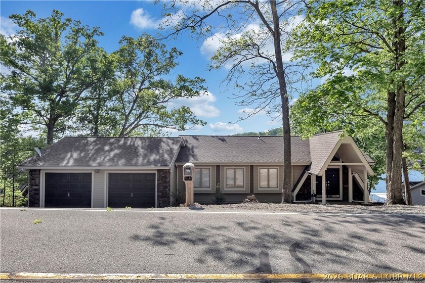 This 3-bedroom, 2-bath home on Nonsuch in Lake Ozark is now - photo 2