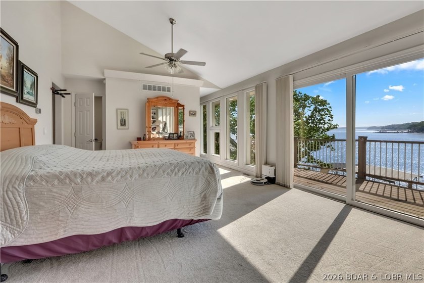 This 3-bedroom, 2-bath home on Nonsuch in Lake Ozark is now - photo 8