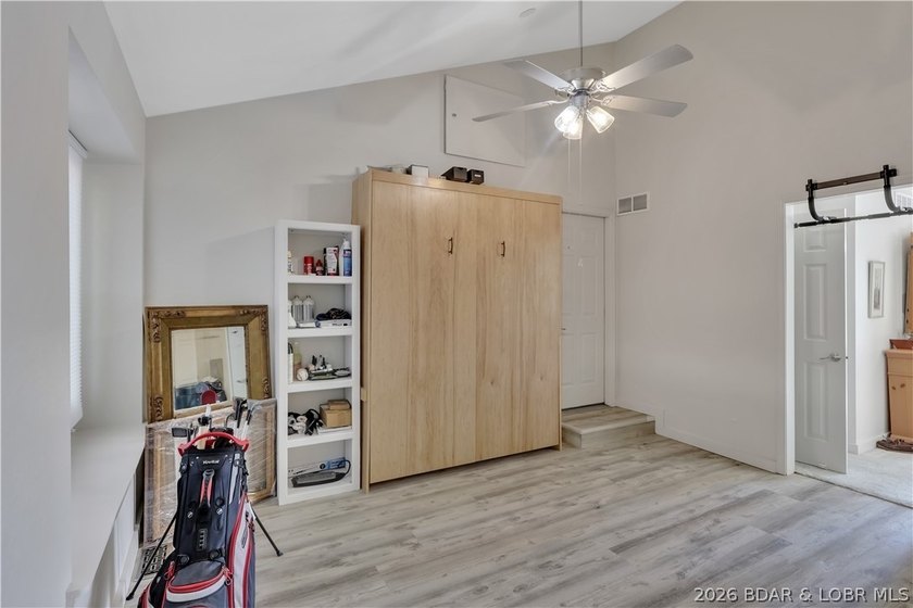 This 3-bedroom, 2-bath home on Nonsuch in Lake Ozark is now - photo 9