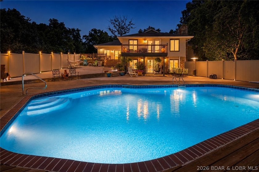 Nestled on over 2 acres with panoramic views of Lake of the - photo 2