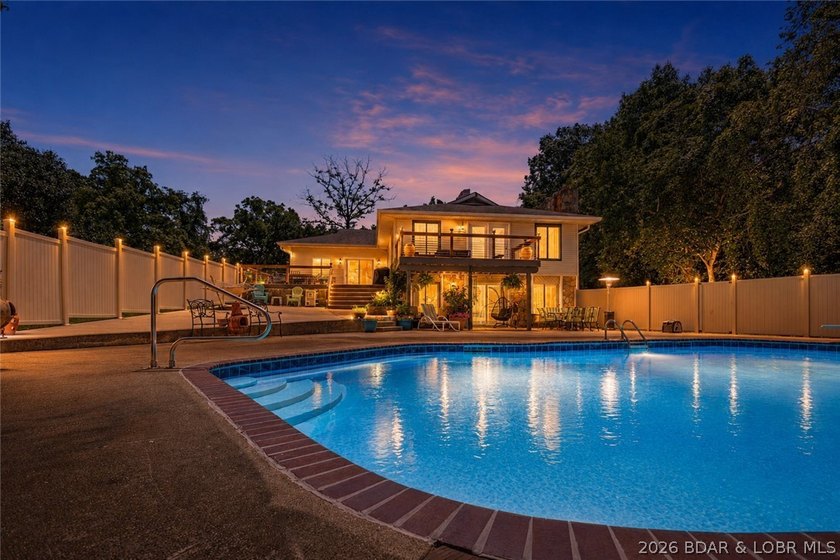 Nestled on over 2 acres with panoramic views of Lake of the - photo 3