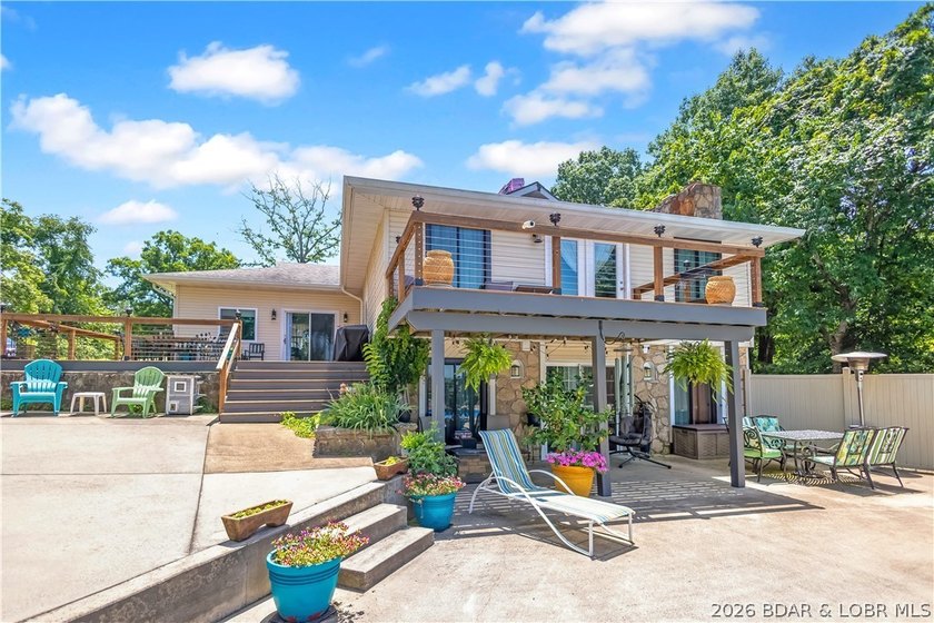 Nestled on over 2 acres with panoramic views of Lake of the - photo 5