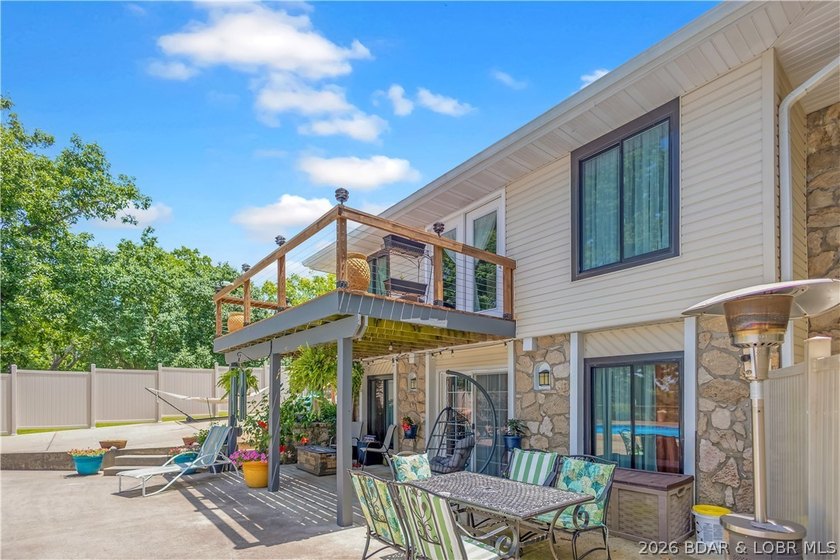 Nestled on over 2 acres with panoramic views of Lake of the - photo 6