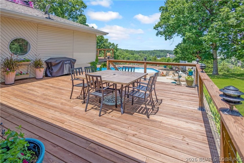 Nestled on over 2 acres with panoramic views of Lake of the - photo 7