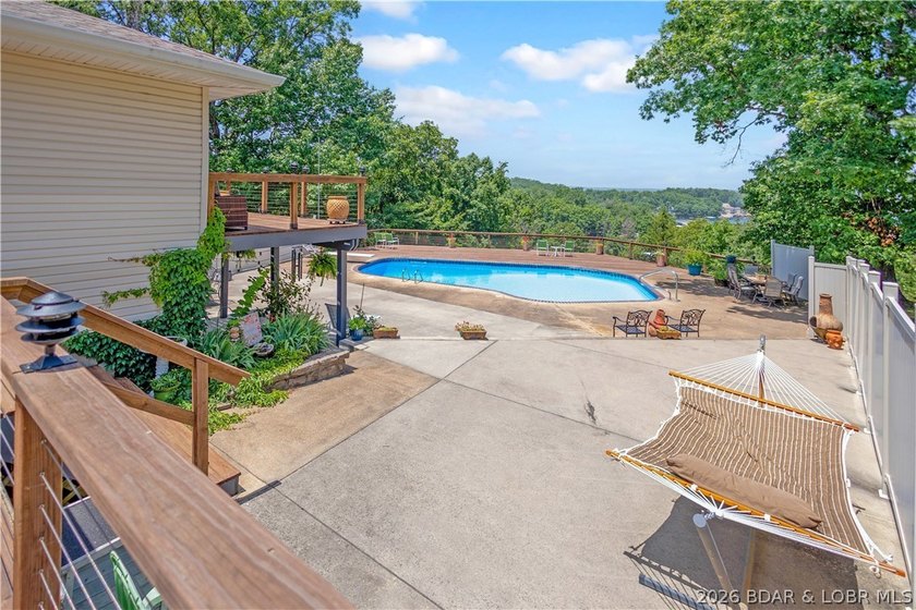 Nestled on over 2 acres with panoramic views of Lake of the - photo 8