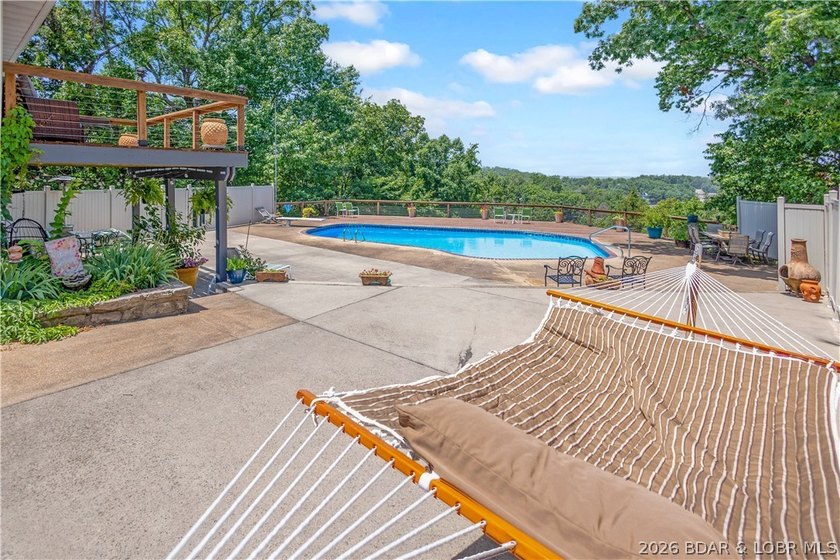Nestled on over 2 acres with panoramic views of Lake of the - photo 9