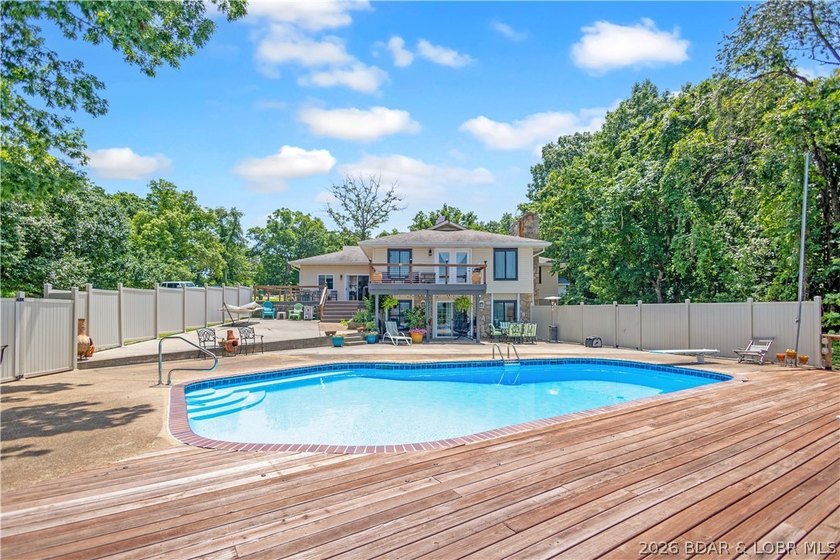 Nestled on over 2 acres with panoramic views of Lake of the - photo 10