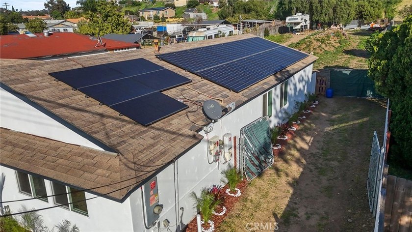 This beautifully updated 4-bedroom, 2-bathroom home with a 2-car - photo 27