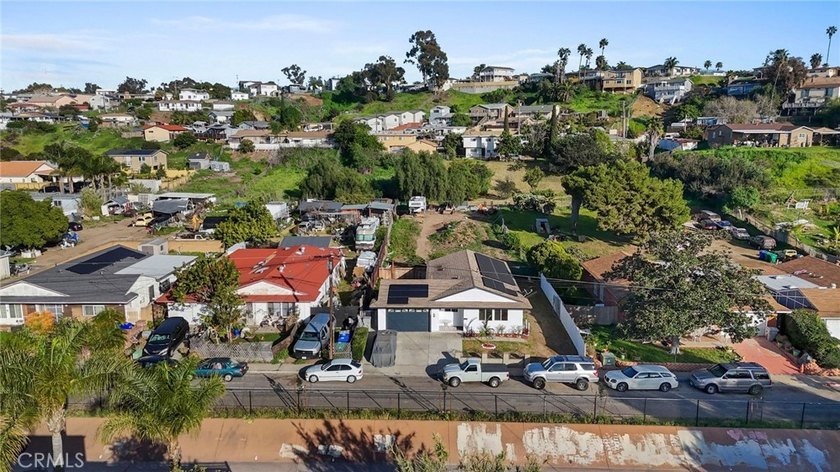 This beautifully updated 4-bedroom, 2-bathroom home with a 2-car - photo 29