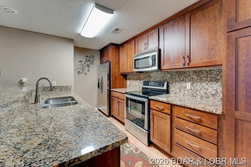 Experience the fantastic views and lakeside living at the highly - photo 5
