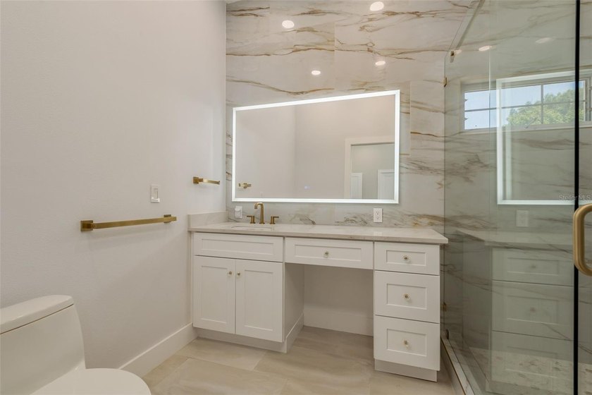 Privacy prevails on this custom home nestled on over an acre of - photo 22