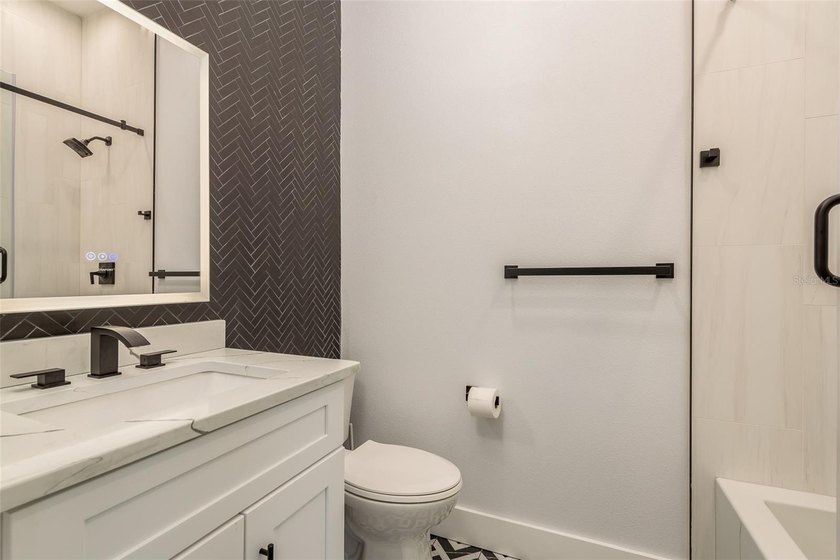 Privacy prevails on this custom home nestled on over an acre of - photo 24