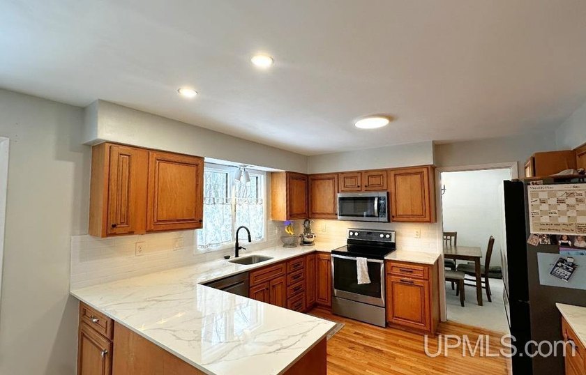 Nestled in one of Marquette's most desirable neighborhoods, this - photo 10
