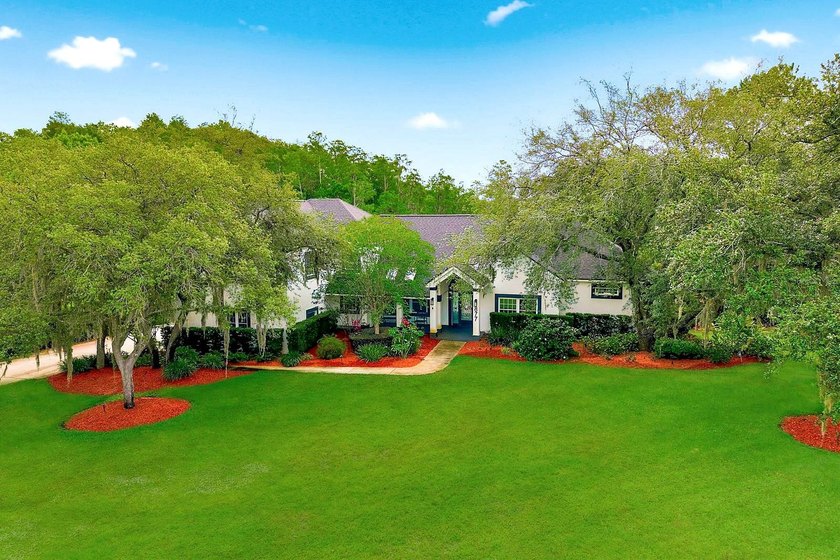 Privacy prevails on this custom home nestled on over an acre of - photo 46