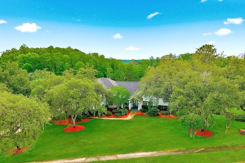 Privacy prevails on this custom home nestled on over an acre of - photo 47