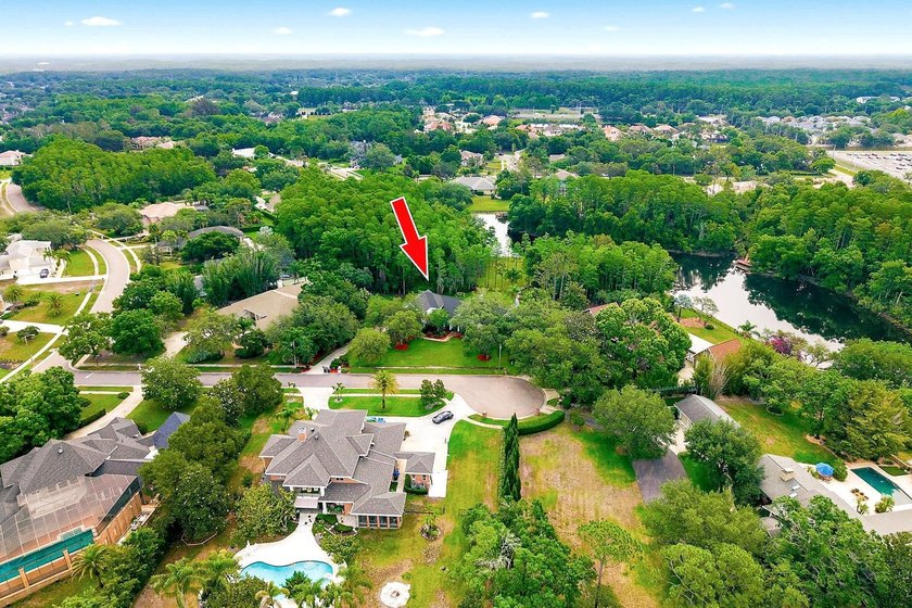 Privacy prevails on this custom home nestled on over an acre of - photo 48