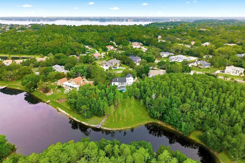 Privacy prevails on this custom home nestled on over an acre of - photo 50