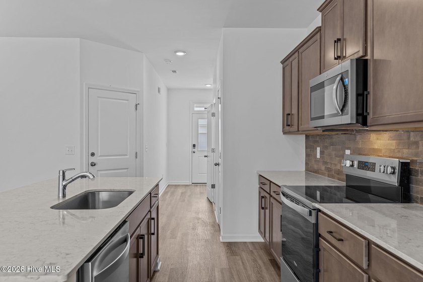 MOVE IN READY! Experience effortless, low-maintenance living in - photo 3