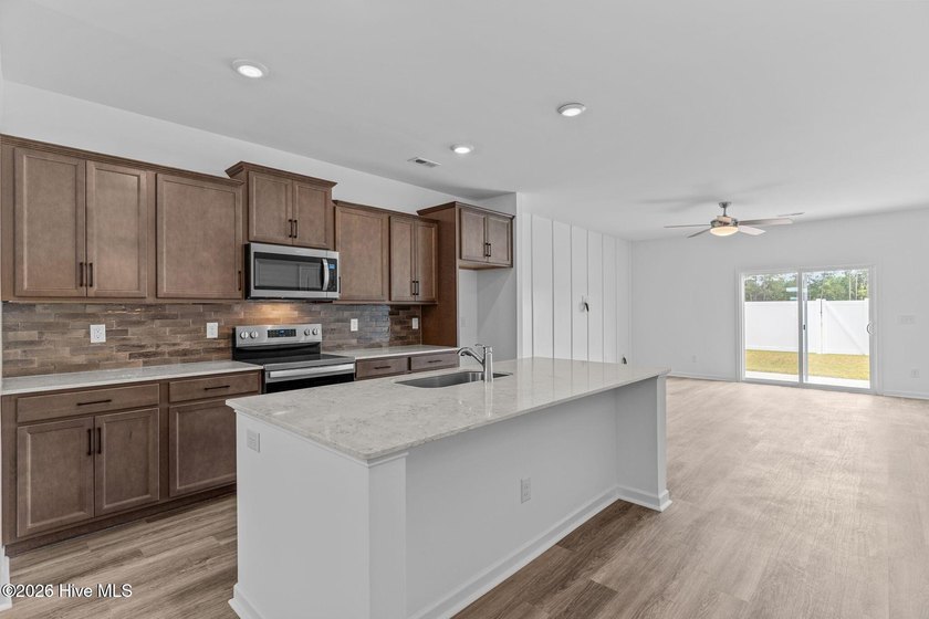 MOVE IN READY! Experience effortless, low-maintenance living in - photo 5