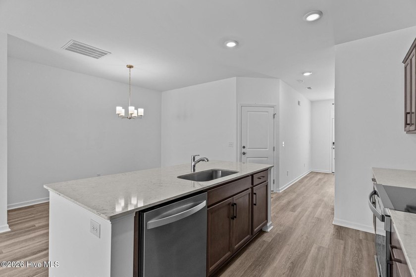 MOVE IN READY! Experience effortless, low-maintenance living in - photo 6