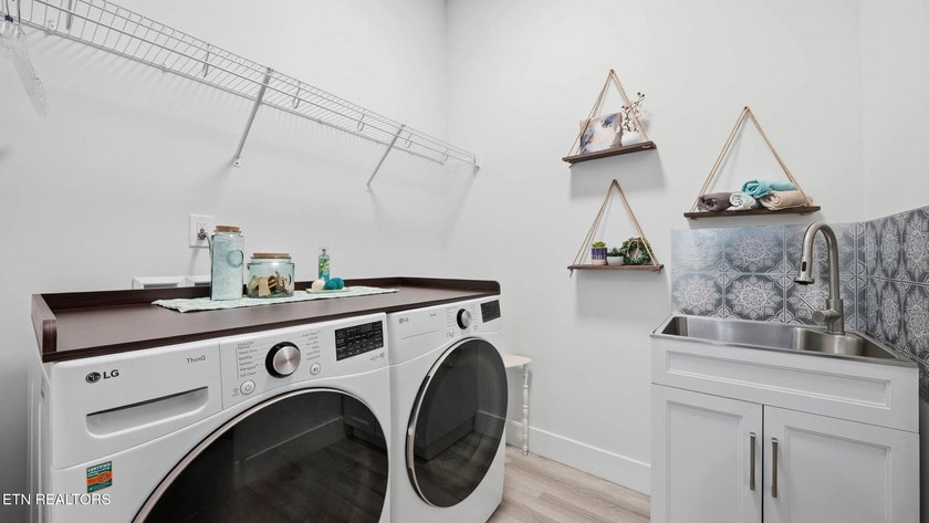 Welcome home to this beautifully designed five bedroom, two and - photo 28