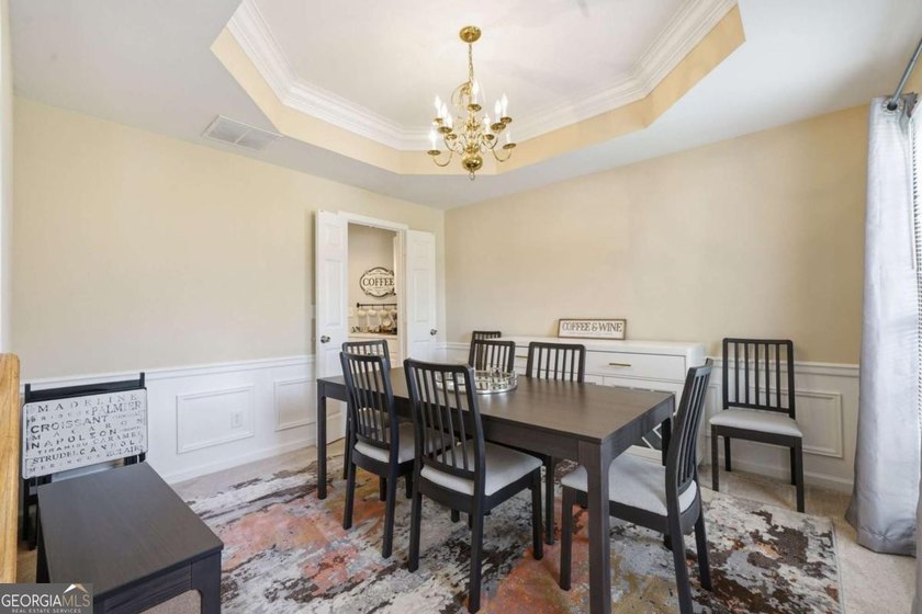 Nestled in the highly sought-after Waters Edge, this traditional - photo 5