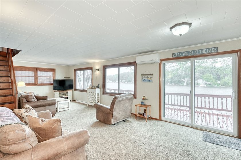 Tucked into the hillside, this awesome lakefront home offers so - photo 12