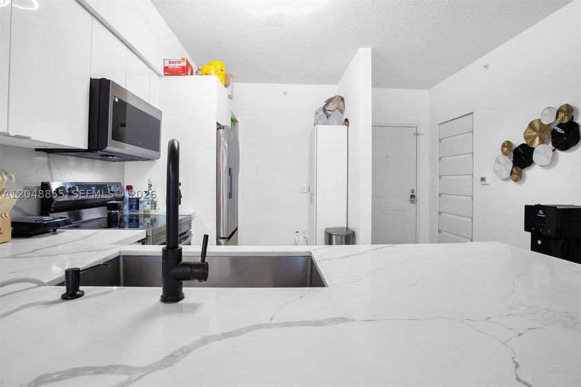 Welcome to this bright and inviting 2-bedroom, 1-bathroom condo - photo 12