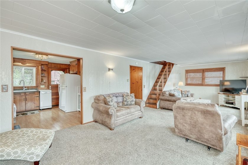 Tucked into the hillside, this awesome lakefront home offers so - photo 13