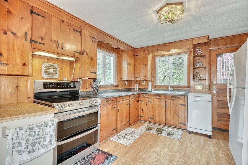 Tucked into the hillside, this awesome lakefront home offers so - photo 15