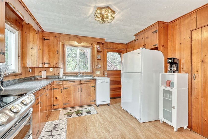 Tucked into the hillside, this awesome lakefront home offers so - photo 16