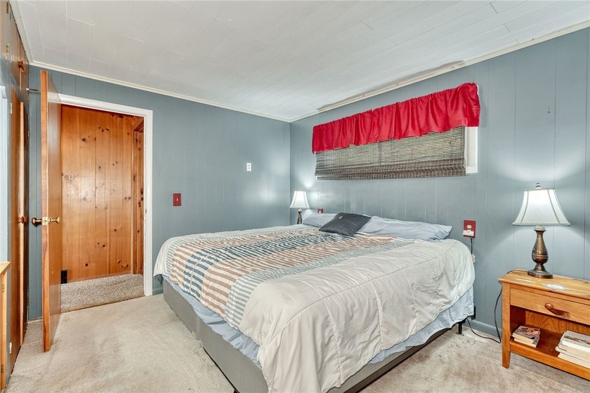 Tucked into the hillside, this awesome lakefront home offers so - photo 19