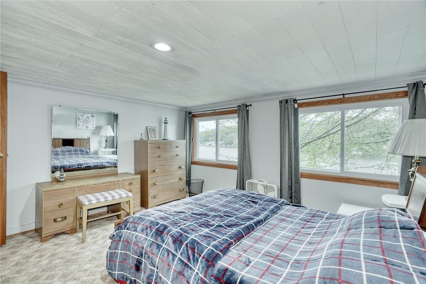 Tucked into the hillside, this awesome lakefront home offers so - photo 32