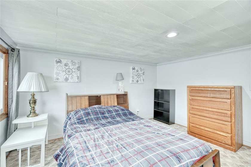 Tucked into the hillside, this awesome lakefront home offers so - photo 33
