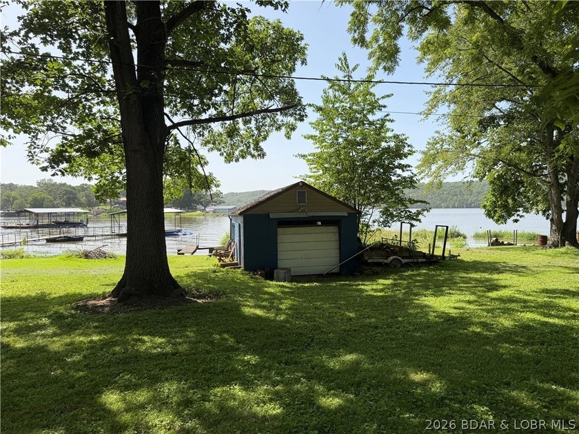 Rare 4-Lot Lakefront Property;Bonus Dock Lot Embrace this - photo 10
