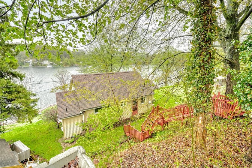 Tucked into the hillside, this awesome lakefront home offers so - photo 49