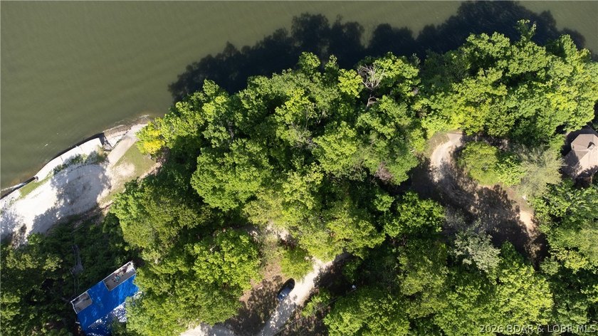 Enjoy over 200 feet of lakefront with deep water, expansive main - photo 4
