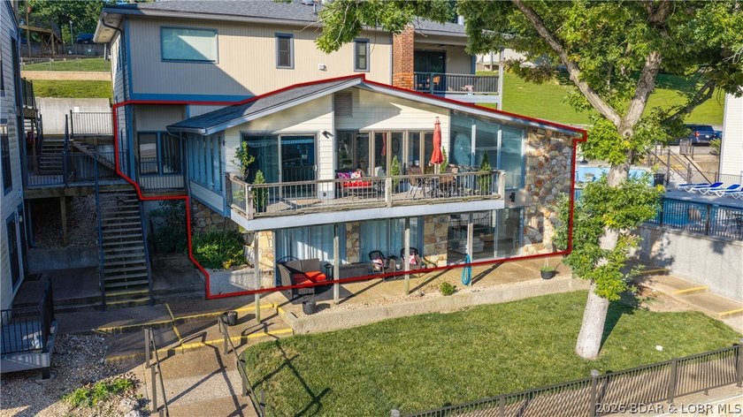 This rare lakefront villa-esque condo is one of only 2 units in - photo 2
