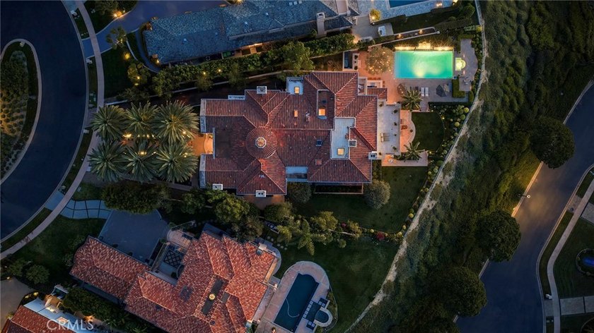 Set behind the guarded and patrolled gates of Pelican Hill in - photo 16