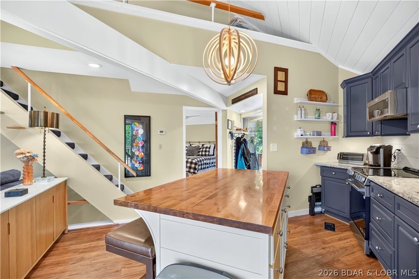 Distinctive architecture meets effortless lake living in this - photo 5