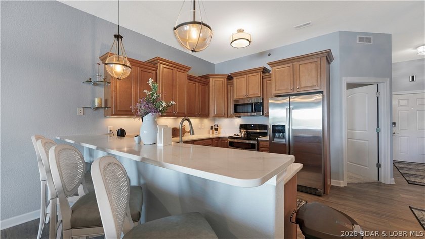 Experience refined lakefront living in this fully updated - photo 7