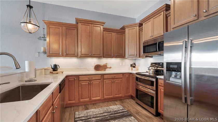 Experience refined lakefront living in this fully updated - photo 8