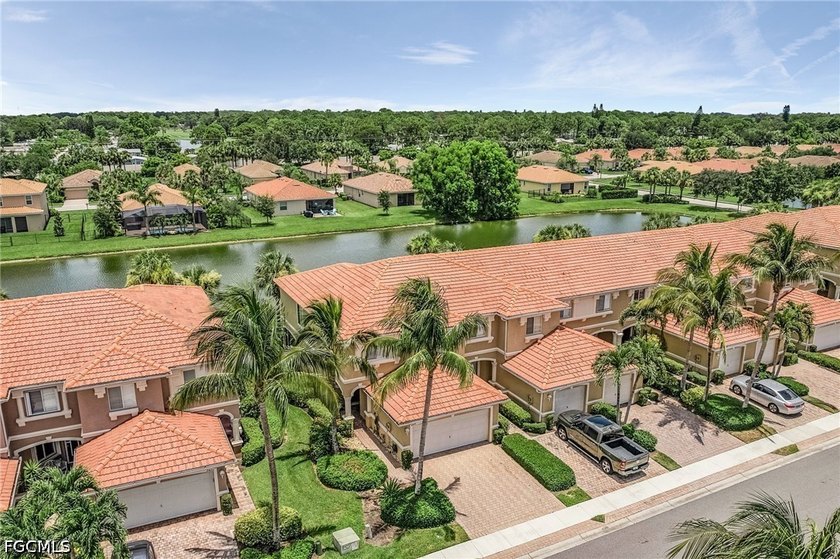 End unit with a 2-car garage and serene lake views! This - photo 22