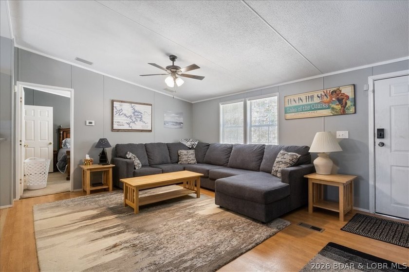 Discover this beautifully updated 4-bedroom, 3-bath lakefront - photo 2